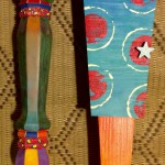 mixed media assemblage: old wood cabinet, wooden utensils, painted sticks, collage, acrylic paint, watercolor